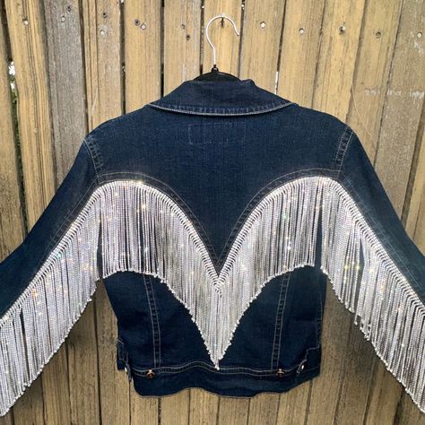 Western-inspired denim jacket embellished with the highest-quality rhinestone fringe (hand-sewn)- available in rose gold or silver. Available in sizes S, M, L, XL, and XXL. 96% cotton 4% spandex Denim Jacket With Tassels, Barbie Cowboy, Fringe Jacket Outfit, Fringe Jean Jacket, Western Fringe Jacket, Black Rodeo, Fringe Denim Jacket, Denim Cowgirl, Rhinestone Jacket