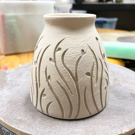 This little pot is only about 3 inches tall and asked for a simple design. It’s winter outside but I’m dreaming of spring already so little buds came to mind. Now to clean up the lines, and get it dried and fired. #pottery #wheelthrown #carvedpottery #budvase #ceramics #handmadepottery Clay Carving Designs, Winter Outside, Pottery Supplies, Ceramic Texture, Sculptures Céramiques, Pottery Handbuilding, Tanah Liat, Slab Pottery, Hand Built Pottery