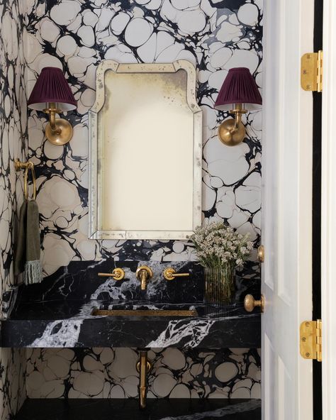 Our latest work: a formal powder bath that stops you in your tracks! Hand-marbled wallpaper by @ruleofthreestudio captivates alongside a… | Instagram Calacatta Viola Powder Room, Statement Half Bath, Dramatic Half Bath, Bold Powder Room Wallpaper, Powder Bath Wallpaper Ideas, Maximalist Powder Room, Moody Powder Bath, Bold Wallpaper Bathroom, Black And White Marble Bathroom