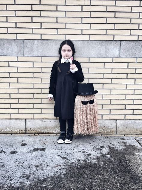 Kids Wednesday Addams and Cousin It Halloween costume | diy Halloween costume | livelovesara | halloween costume | wednesday addams | Kids Halloween Costume | Addams Family Costume It Halloween Costume, Carnaval Outfits, Wednesday Costume, Cousin It, Trick Or Treat Bucket, Wednesday Addams Costume, Addams Family Costumes, Treat Bucket, Halloween Buckets