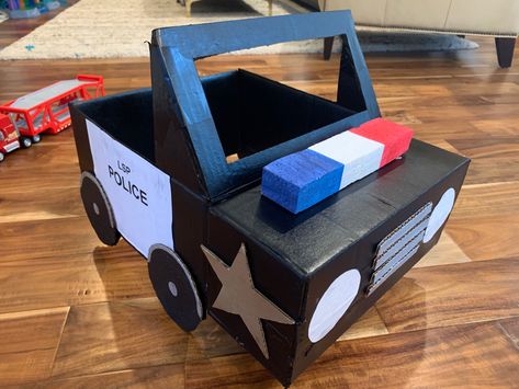 Race Car Box Diy, Card Board Box Car Diy, How To Make Cars Out Of Cardboard Boxes, Police Car Out Of Cardboard, Transportation Cardboard Boxes, Cardboard Police Car Diy, Cardboard Box Car Costume, Cardboard Box Transportation Ideas, Cars Out Of Cardboard Boxes