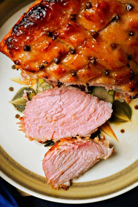 Glazed Ham with Marmalade and Mustard, a must-try recipe for your festive dinner. Moist cooked ham coated in a wonderfully spiced marmalade and mustard glaze with whole cloves pressed into the ham, it really can't get any more delicious than this! Marmalade Ham Glaze, Whole Ham Recipes, Mustard Ham Glaze, Gammon Recipes, Holiday Ham Recipes, Whole Ham, Cooked Ham, Leftover Ham Recipes, Glazed Ham