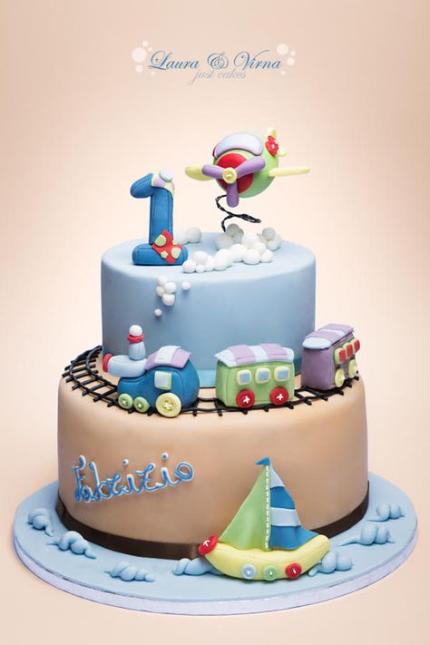 A cake for the first year of a baby boy. It includes the sea, ground and sky with the most popular toys for boys. Sailboat Cake, Rodjendanske Torte, 1st Bday Cake, Baby Boy Birthday Cake, Train Cake, Boy Cake, Airplane Baby, 1st Birthday Cakes, Baby Boy Cakes