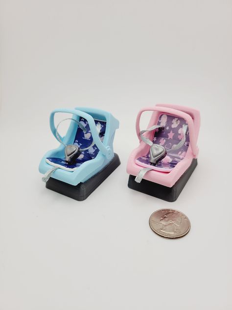 1:12 Scale Miniature Car Seat/Carrier with Base  This would make a great addition your dollhouse nursery, diorama, roombox, or use as a prop when creating scenes 2 Options Available  Blue Seat with Gray Base Pink Seat with Gray Base Measure your mini babies for fit!  These were made to fit 1.5 inch - 2.50 inch babies.  I have the straps fairly loose to allow a baby to be inserted. Carrier cannot be removed from Base Straps Are Not Adjustable  Handle is stationary.  Please do not try to adjust it.  Foam Seat is covered in laminated vinyl 3D printed with PLA Dimensions in Inches 1.50 W x 2.75 D x 2.35 H Doll is not included....for size reference only.  She measures 5.75 inches These are not a toy!  They are meant for display only. As with all my handmade items, please allow for slight differ Nursery Diorama, Baby Doll Car Seat, Baby Doll Furniture, Miniature Nursery, Dollhouse Nursery, Baby Doll Nursery, Miniature Stuff, Mini Toys, Paper Dolls Diy