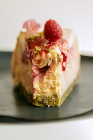 Raspberry, Rose & Vanilla Cheesecake with Pistachio Rose Crust Easy Pistachio Cheesecake Recipe, Cherry Pistachio Cheesecake, Pistachio Rose Cheesecake, Cheesecake Recipes Pistachio, Luscious Lemon Raspberry Cheesecake, Pistachio Rose, Pistachio Shortbread, Ashley Alexander, Mouthwatering Desserts