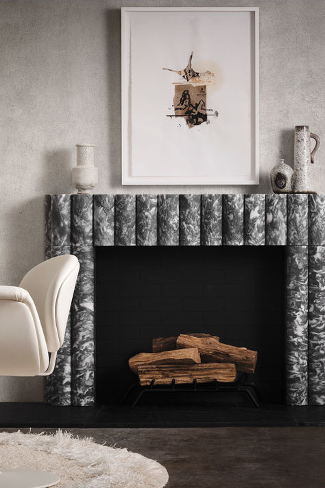 Living space with black and white marble fireplace, artwork hanging above the fireplace mantel, and decor on the fireplace mantel. Bel Air House, Art Deco Fireplace, Contemporary Houses, Ann Sacks Tiles, Ann Sacks, Stone Products, Inside Design, Home Fireplace, Marble Fireplaces