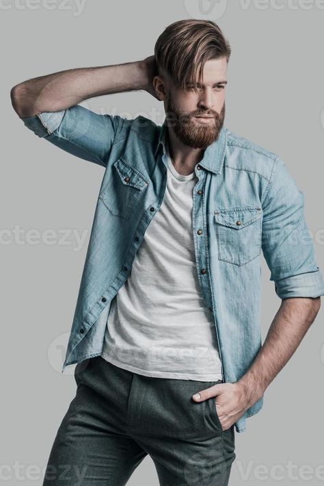 Trendy look. Handsome man looking away and holding hand on his neck while posing against grey background How To Look Handsome, Handsome Man, Grey Background, Men Looks, Gray Background, Holding Hands, Royalty Free Stock Photos, Grey