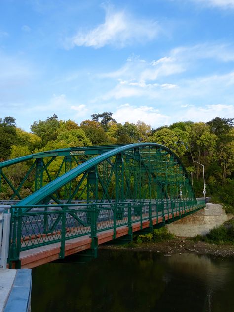 Blackfriars Bridge over the Thames River in London, Ontario, Canada. This green bridge is a historic wrought iron truss bridge. Downtown London, Blackfriars Bridge, Ontario Canada Travel, Green Bridge, University Aesthetic, Truss Bridge, Thames River, Rick Steves, Canada Ontario