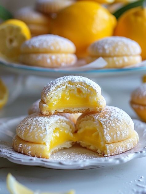 Here’s a recipe to make these delightful lemon cookies filled with lemon custard and limoncello International Baked Goods, Lemon Delight Recipe Amalfi, Lemon Pastry Recipes, Stuffed Lemon Cookies Recipe, Stuffed Lemon Cookies, Lemon Filled Cookies, Lemon Baked Goods, Easy Fall Party Food, Fall Party Food Ideas