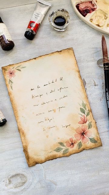 Myno Varela | Botanical Art on Instagram: "Vintage Love Letter 🤎✉️🌸 @artphilosophyco Love, Flowers & Chocolate Party! 👉🏻Tips to get old paper effect: 🩷 torn edges (you can use a ruler or slightly wet the paper and cut with your fingers). 🩷 use brown watercolor with lots of water.  I used AP concentrated watercolor (Cafe).  Saturates the color at the edges. 🩷 add splashes and stains with colors Cafe and Denim. 🩷 you can paint some flowers and voila! Now you are ready to write a letter to Coffee Stained Paper Love Letters, Coffee Paper Letter, Paint On Brown Paper, How To Make Vintage Paper With Coffee, Design For Love Letter, Love Letter Paper Design, How To Make Vintage Letters, Aesthetic Letters Ideas, Love Letter Design Ideas