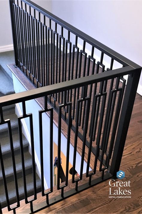 A modern rail design in a rectangle pattern is coated in oil-rubbed bronze in a newly renovated home. Metal Staircase Railing, Balcony Railing Design Modern, Iron Staircase Railing, Woods Home, Iron Balcony Railing, Metal Stair Railing, Steel Railing Design, Metal Fencing, Modern Stair Railing