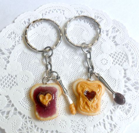 This is a pair of peanut butter and grape jelly keychains.. one for you and one for your bff! :) Handmade by me with polymer clay. And each has a little knife or spoon charm with some 'peanut butter' & 'jelly' on them. :) **As these are handmade, there will be slight variations. PLEASE READ FOR SHIPPING TIME- MY TURNAROUND TIME right now is approximately up to 1 week before shipping this item (unless you purchase priority shipping). IF YOU NEED YOUR ORDER SOONER, I do have priority shipping Jelly Hearts, Keychains Cute, Grape Jelly, Matching Keychains, Peanut Butter And Jelly, Gift Inspo, Sister Wife, Heart Keychain, Keychain Set