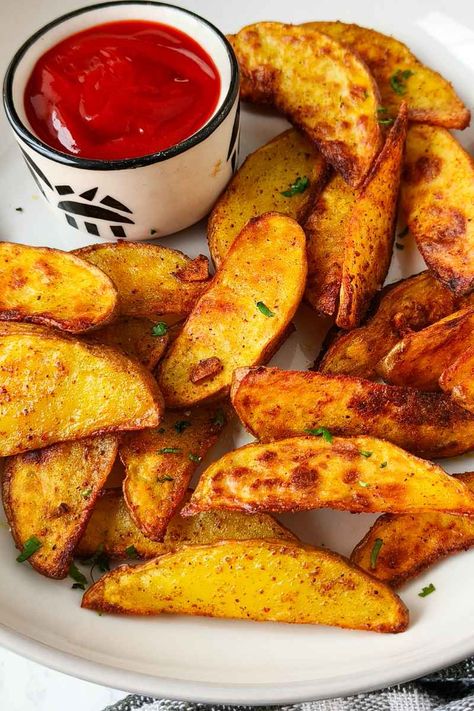 easy and quick air fryer potato wedges on a plate with red tomato sauce Baked Plantain Chips, Southwest Chicken Salad, Potato Wedges Recipe, Red Skin Potatoes, Vegetable Fried Rice, Plantain Chips, Cilantro Lime Chicken, Cauliflower Curry, Red Lentil Soup