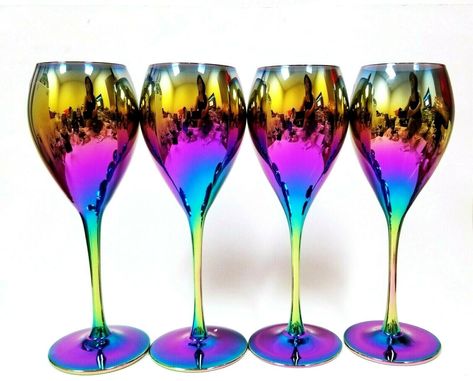 NEW SET OF 4 METALLIC RAINBOW,MIRROR REFLECTIVE WINE,GOBLET,STEM GLASS BRAND NEW  Condition: Brand new Approximate Dimensions: 9.75" tall, 2.5" DIAMETER AT THE TOP,3.25" ON THE BASE Description:   SET OF 4 HIGHLY REFLECTIVE AND METALLIC RAINBOW MIRROR, WINE GOBLET GLASS. SHIPPING Shipping cost is automatically calculated by EBay based on weight. We do offer combination discounts; any purchases made within the same day qualifies for combination discount. If this discount does not happen automatic Rainbow Cookware, Violet Bedroom, Rainbow Stuff, Rainbow Mirror, Colorful Glasses, Rainbow Kitchen, Smith Wedding, Random Products, Metallic Rainbow