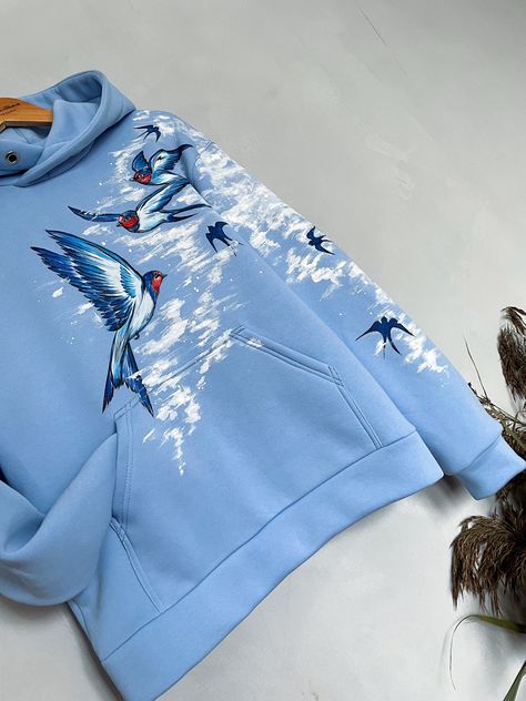 High quality hoodie with swallows.  Swallows are a symbol of spring, lightness, rebirth, goodness and happiness.  The drawing is applied by hand with brushes and special paints. Therefore, each product is not 100% similar to the previous one and is unique. ✨Material: ✅Premium quality knitwear (95% cotton, 5% elastane) ✅Soft and comfortable to wear ✅Colorfast and resistant to deformation ✅Unisex (suitable for both men and women) HOW TO ORDER 1. Select 𝗦𝗶𝘇𝗲. 3. Choose the desired color of the hoodie 4. Click 𝗔𝗗𝗗 𝗧𝗢 𝗖𝗔𝗥𝗧. 🚨Custom-made designs may differ slightly from the original in the photo. Because each product is hand-painted and unique.🚨 📏Size Guide: Refer to the size chart in the photos For the most accurate fit, measure your own hoodie and compare to the chart We will c Painting On Hoodies, Drawing On Hoodie, Unique Hoodies Design, Cool Hoodies Designs Unique, Hoodie Painting Ideas, Hand Painted Hoodie, Cool Hoodies Designs, Hand Painted Clothes, Painted Hoodie