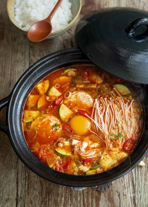 Sundubu Jjigae in just 10 minutes! Try this easy recipe made with canned tuna. Enjoy this Korean soft tofu soup packed with spicy tuna, fresh veggies, and traditional seasonings. A comfort soup every Korean food lover will appreciate. Tofu Soup Recipes, Korean Tofu Soup, Sundubu Jjigae, Jjigae Recipe, Korean Tofu, Korean Soup, Tofu Soup, Korean Side Dishes, Canned Tuna