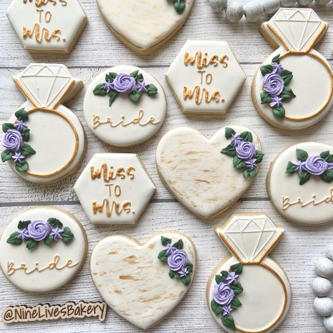 Bridal shower sugar cookies with royal icing Bridal Shower Ideas Lilac, Bridal Shower Cookies Lavender, Purple And Yellow Bridal Shower Ideas, Lavender And Gold Bridal Shower Ideas, Dark Purple Bridal Shower Ideas, Purple And White Bridal Shower Ideas, Bridal Shower Lilac Decor, Bridal Shower Ideas Lavender, Lavender Wedding Shower Ideas