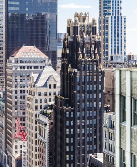 The American Radiator Building (also known as the American Standard Building) is an early skyscraper at 40 West 40th Street, just south of Bryant Park, in the Midtown Manhattan neighborhood of New York City. It was designed by Raymond Hood and André Fouilhoux in the Gothic and Art Deco styles for the American Radiator Company. The original section of the American Radiator Building, a 338 ft-tall (103 m), 23-story tower, was completed in 1924. A five-story annex, to the west of the original tower American Radiator Building, Manhattan Neighborhoods, Bryant Park, Midtown Manhattan, The Gothic, American Standard, What To Eat, Lego City, Architecture Building