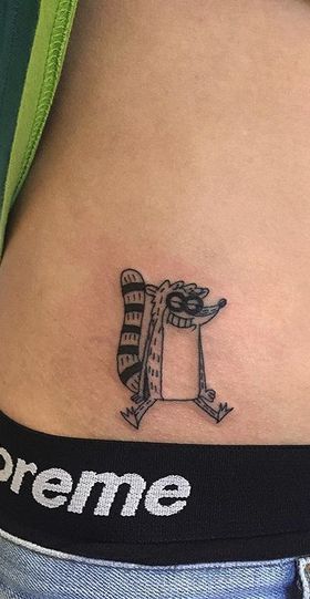 Rigby Tattoo Mordecai And Rigby Tattoo, Small Movie Tattoos, Gta Tattoo Ideas, Rigby Tattoo, Horrible Tattoos, Earthy Tattoos, Master Tattoo, Tattoo Catalog, Funky Tattoos