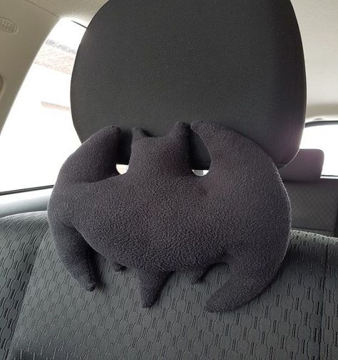 Picture of Car Headrest Pillow Car Theme Ideas Interior, Batman Car Accessories, Diy Car Pillow, Emo Car Interior Ideas, Car Pillow Decor, Car Headrest Pillow, Inner Car Decor, Spooky Car Accessories, Cool Car Ideas