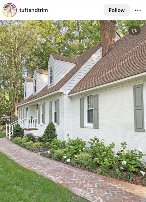 White Farmhouse Landscaping Front Yard, Farmhouse Hydrangea Landscape, Cottage Front Landscaping, French Cottage Landscaping, Builder Grade Exterior, Front Yard Hydrangea Landscaping, Courtyard Front Of House, New Home Exterior Ideas, Adding Character To A Builder Grade Home