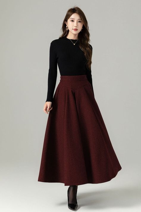 Fluidity and elegance from this chic winter skirt. Team the wool skirt with a chunky sweater, winter boots and an over sized handbag and you're good to go, no matter what the weather throws at you!  DETAIL * 30% wool, 30% fiber, 40% polyester * polyester lining * Two side Seam pockets * Back zipper closure, Back elastic make it more comfortable when wear * Ankle length effect * A Line maxi skirt * Dry clean *  Lean More about the items From the FAQs on the page bottom MODEL SIZE Bust 85 cm(33.4" Winter Skirts And Dresses, Big Sweater With Skirt, Long Wool Skirt Outfit, How To Style Long Skirts In Winter, Velvet Skirt Outfit Winter, Long Winter Skirt, Winter Long Skirt, Outfit Long Skirt, A Line Maxi Skirt