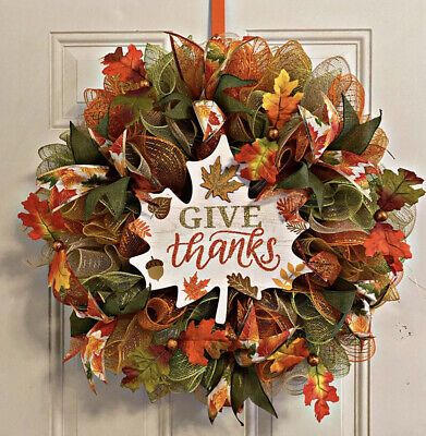 This colorful handmade uniquely gorgeous leaves wreath design is perfect for indoors or outdoors. This wreath is a must have for holiday greetings! Just look at it, can you envision this fall/autumn filled leaves wreath greeting you and/or your guest this holiday season? It definitely has that WOW factor. Always reminding us to Give Thanks!This wreath measures approximately 23in x 23in x 6inThis wreath includes a free orange door hanger that compliments all it's colo Thanksgiving Riddles, Elegant Fall Wreaths, Fall Mesh Wreaths, Fall Deco Mesh Wreath, Orange Door, Fall Thanksgiving Wreaths, Fall Deco Mesh, Holiday Wreaths Diy, Leaves Wreath