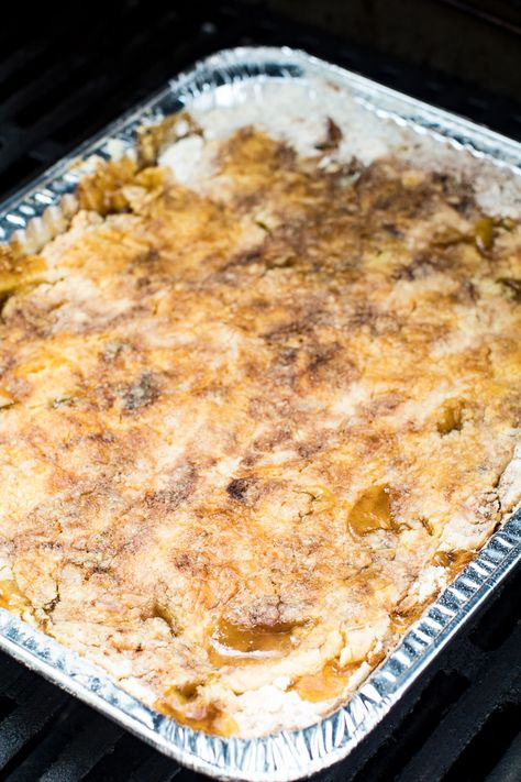 This quick and easy apple dessert is made on your grill for easy clean up! You only need FOUR ingredients and you have an amazing Grilled Apple Dump Cake. It's a perfect dessert for camping! #gimmesomegrilling #apple #appledessert #applecake #dumpcake #dumpdessert #appledumpcake #grill #grilling #grilled #camping #campingrecipe Grilled Apples Dessert, Camp Deserts, Dessert For Camping, Camping Desserts Campfire, Desserts On The Grill, Grilled Pound Cake, Individual Apple Pies, Cake Mix Cobbler, 3 Ingredient Cakes