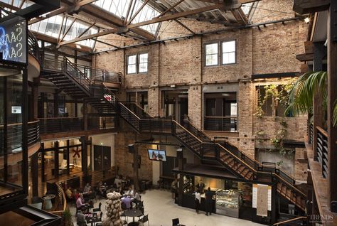 Heritage preservation and adaptive reuse of historic warehouse provides new offices and showrooms, with central café in large atrium Warehouse Living, Warehouse Office, Warehouse Home, Warehouse Design, Industrial Architecture, Casa Container, Adaptive Reuse, Industrial House, Industrial Buildings