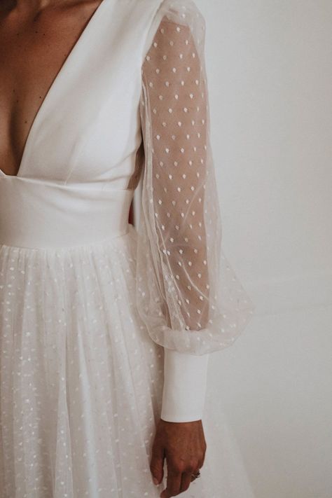 A Sassi Holford wedding dress with long sheer sleeves with polka dots on with a deep neckline Polka Wedding Dress, Spotty Wedding Dress, Swiss Dot Wedding Dress Sleeves, Dotted Wedding Dress, Long Sleeve Wedding Dress With Pearls, Sassi Holford Wedding Dress, Wedding Dress With Pearl Sleeves, Swiss Dot Wedding Dress, Wedding Overlay