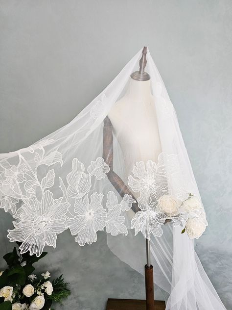 Bespoke/Made to Order 2 Tier veil made in a beautiful soft bridal tulle and high quality lace. Lace can be used to make a standard veil (with or without gathering on a comb), mantila veil, or drop veil.  Contact us to create your own design Width: 150 cm/59 in -------------------------------------------------- SAMPLES Material samples are available for you to check the quality and to match the colour of your wedding dress. -------------------------------------------------- DELIVERY The standard delivery service we use normally takes 3-5 working days for domestic orders and 10-14 days for international orders. -------------------------------------------------- SPECIAL SIZES Special size items are available on request; please do not hesitate to contact me for details ------------------------ Bridal Veil Ideas, Cathedral Veil With Blusher, Unique Veils, 2 Tier Veil, Veil Fashion, Floral Wedding Veil, Unique Wedding Veils, Mantilla Veil Wedding, Unique Veil