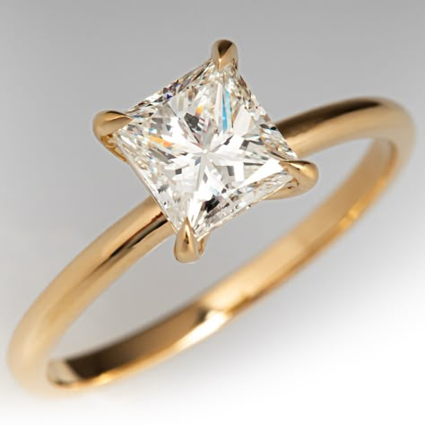 This elegant solitaire ring contains one (1) princess cut diamond weighing 1.03 carats that is set into a four-prong setting. The ring measures 7.0mm at the top, rises 5.8mm above the finger, tapering to 1.7mm wide and 1.2mm thick at the base of the shank. It is currently a size 6.5. Gold Princess Cut Solitaire Engagement Ring, Engagement Rings Gold Princess Cut, Gold Engagement Rings Square, Engagement Rings Princess Cut Gold, Simple Princess Cut Engagement Rings Gold, Gold Engagement Ring Princess Cut, Princess Solitaire Engagement Ring, Yellow Gold Princess Cut Ring With Single Cut Diamonds, Princess Cut Gold Band