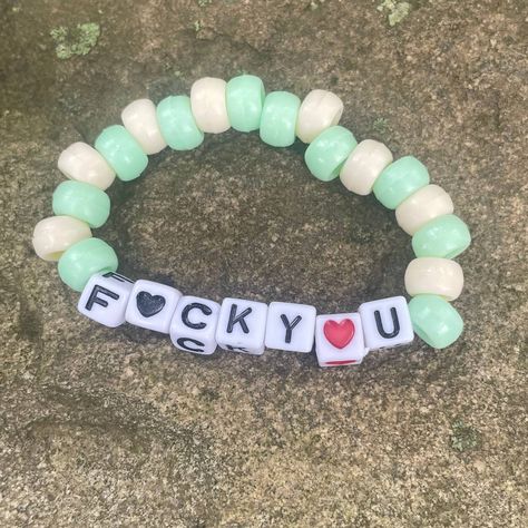 F<3ck You Green And Cream Funny Bead Bracelet Osfm Nwt *1 Bead Bracelet That Says F<3ck You And The U& O Is A Heart With Light Green And Cream Beads *One Size Fits Most *Handmade *New Check Out Our Other Handmade Bracelets And More! Brackets Ideas Clay Beads, Cavetown Bracelets, Bracelets Green, Green Day Bracelet, Silly Bracelets, Candy Bracelet Ideas, Funny Bracelet Ideas, Funny Friendship Bracelets, Funny Bracelets