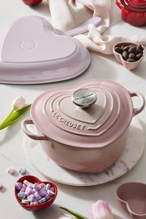 The Le Creuset Hearts Collection features Dutch Ovens, cocottes and kitchen accessories that have been fashioned into swoon-worthy heart shapes or topped with gold and silver heart knobs. Available in our passionate red Cerise, sweet Licorice black, and delicate Shell Pink colors, the collection is sure to warm hearts. Heart Shaped Le Creuset, Pink La Creuset, Le Creuset Cocotte, Le Creuset Aesthetic, Pink Kitchenware, Pink Kitchen Inspiration, Pink Le Creuset, Le Creuset Heart, Le Creuset Pink