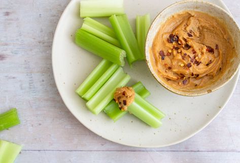 Keto Celery and Spicy Peanut Butter Dip | Carb Manager Keto Celery, Celery Snacks, Spicy Peanut Butter, Peanut Butter Dip, Carb Counter, Smooth Peanut Butter, Diet Tracker, Tamari Sauce, Carb Alternatives