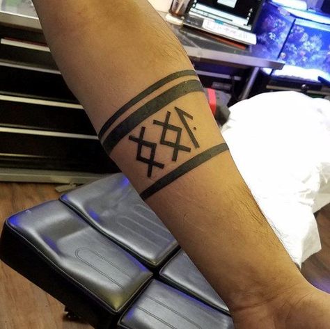 Rune Mens Black Ink Forearm Band Tattoo Viking Arm Band Tattoo, Forearm Band Tattoo Design For Men, Viking Arm Band Tattoos For Men, Runes Tattoos, Forearm Band Tattoo, Nordic Sleeve, Band Tattoo Ideas, Viking Rune Tattoo, Leg Band Tattoos