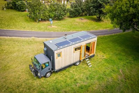 This woman's incredible tiny house truck is every solo female traveler's dream Tiny House Truck, Box Truck Camper, House Truck, Rv Diy, Truck Conversion, Installing A Fireplace, Truck House, Off Grid Tiny House, Composting Toilets