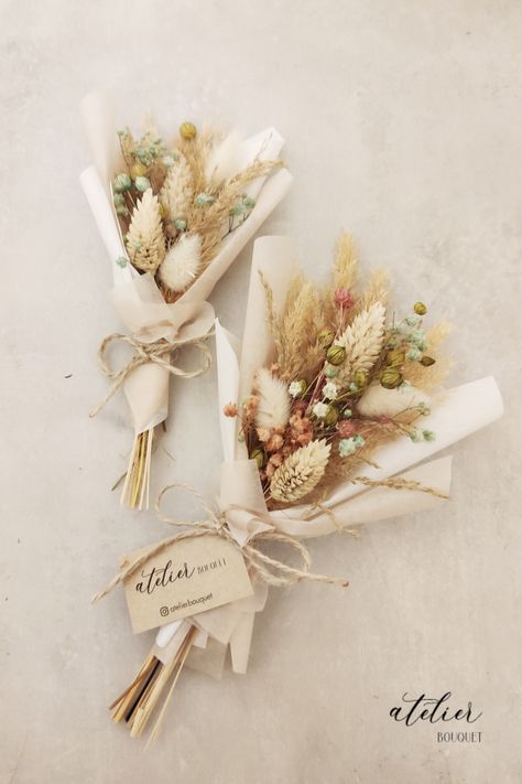 Surprise and delight your wedding guests with these charming dried mini bouquets, perfect for gifting as a heartfelt thank-you. One bouquet is slightly larger than the other and features delicate white and pink flowers. The other is a smaller version, perfect for holding and admiring up close. Each bouquet is made with attention to detail that matches your wedding colors. These timeless bouquets are sure to delight all of your guests, and serve as a cherished reminder of your special day." Single Dried Flower Bouquet, Mini Dried Flower Bouquet Diy, Small Dry Flower Bouquet, Mini Dried Bouquet, Dried Flowers Ideas Bouquet, Dried Flowers Bouquet Gift, Dried Flower Bouquet Tutorial, Dried Flowers Gift Ideas, Dried Flower Boquet