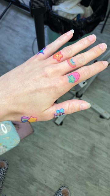 Tattoo Cute on Instagram: "Finger tats! My new favorite thing. Come get some! ✨🌟🌈💖🌸🍓. #fingertattoo #fingertattoos #kawaiitattoo #kawaiitattoos #cutetattoo #cutetattoos #colorfultattoo" Finger Tattoos Colorful, Kawaii Finger Tattoo, Colorful Finger Tattoo, Hand Tattoos Colorful, Pink Finger Tattoo, Color Finger Tattoo, Anime Finger Tattoos, Hand Tattoo Color, Colorful Hand Tattoos