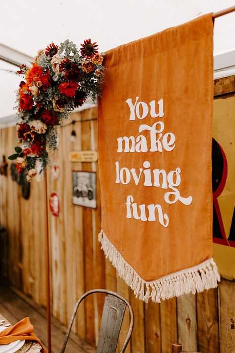 Orange Table Decor Banner Sign Boho Retro 70s Daisy Jones Six Wedding Ideas Caroline Opacic Photography #wedding #weddingdecor 70s Inspired Fall Wedding, Retro Rustic Wedding, 1970 Wedding Theme, 70s Fall Wedding, 1970s Wedding Decor, Fall Retro Wedding, Retro Country Wedding, Retro Wedding Welcome Sign, Retro Wedding Arch