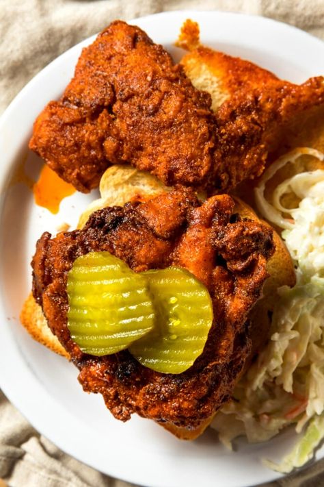 Hot, crisp, and super delicious, Nashville hot chicken is the king of fried chicken. It's so succulent and fiery, you'll want to lick the plate clean. Hot Nashville Chicken Recipe, Dave’s Hot Chicken Copycat Recipe, Dave’s Hot Chicken Recipe, Daves Hot Chicken Copycat, Nashville Hot Chicken Sandwich Recipe, Nashville Hot Sauce, Red Hot Chicken, Nashville Fried Chicken, Nashville Hot Chicken Sandwich