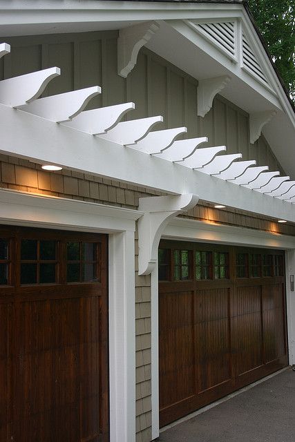 These rich looking wood doors are sure to be the envy of the neighborhood! Garage Arbor, Garage Trellis, Door Pergola, Casa Garage, Garage Pergola, Wooden Garage Doors, Carriage Doors, Wooden Garage, Garage Door Design