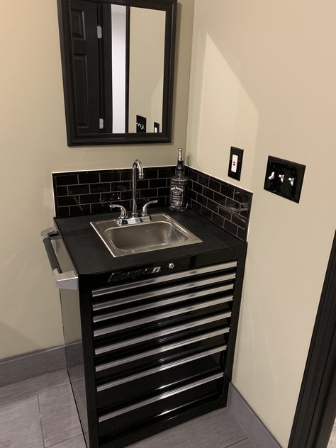 Toolbox sink with black subway tile and black grout🖤 Tool Box Sink Bathroom, Auto Shop Bathroom Ideas, Automotive Repair Shop Waiting Rooms, Race Car Bathroom Ideas, Mechanic Waiting Room Ideas, Shop Bathroom Ideas Garages, Mechanic Shop Design, Mechanic Bathroom, Mechanic Shop Ideas