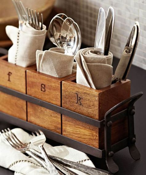 Vintage Flatware Caddy Vintage Flatware Caddy: Vintage Blacksmith flatware Caddy. Three mango wood coffers are set inside a blackened iron frame to create this handsome caddy, perfect for sharing serving utensils, napkins and flatware. Curved handles make it easy to pass around the table. Essential Kitchen Items, Kitchen Caddy, Flatware Caddy, Vintage Flatware, Cutlery Holder, Entertaining Essentials, Decorative Pottery, Utensil Holder, Kitchen Items