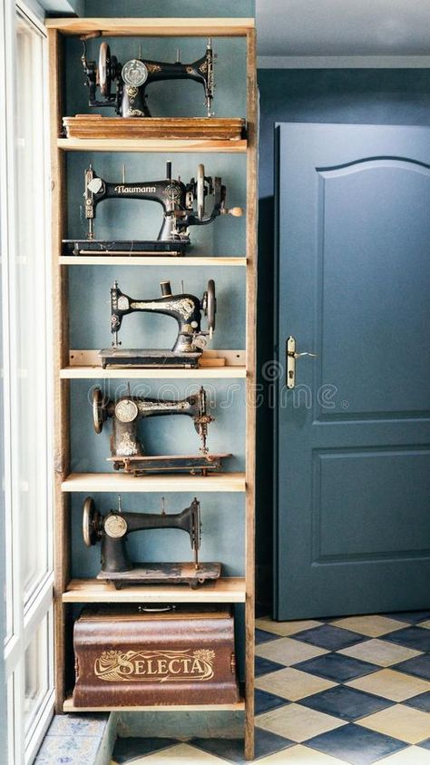 Photo about Krakow, Poland. September 22 2018. Vintage sewing machines on the wooden shelves in the retro room. Image of machines, three, shelf - 142451196 Sewing Machine Shelf, Vintage Sewing Machine Display, Vintage Sewing Display, Sewing Room Vintage Style, Dark Sewing Room, Antique Sewing Machines Decoration, Sewing Room Vintage, Vintage Sewing Room Decor, Gothic Sewing Room