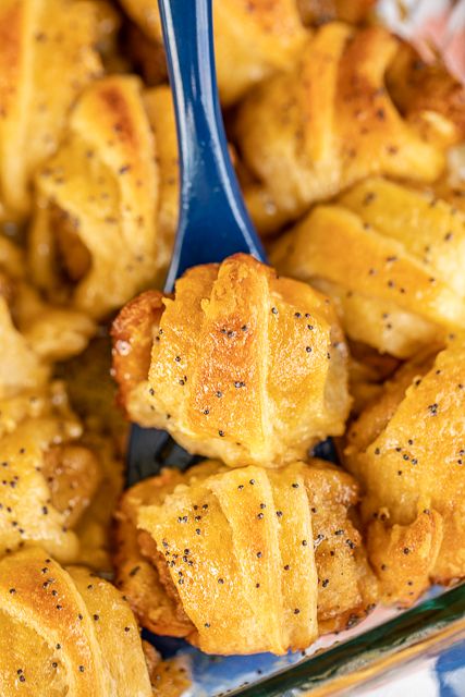 Glazed Chicken Minis - chicken nuggets wrapped in crescent rolls and baked in a sweet and savory brown sugar glaze. Took these to a party and they were gone in minutes!!! Crescent rolls, frozen popcorn chicken, brown sugar, butter, poppy seeds and Worcestershire sauce. I have zero self-control around these things! Dangerously delicious!! A MUST for all your tailgates and parties! #tailgating #chickfila #chickenmini #partyfood #appetizer Chicken Nuggets Appetizer, Canned Chicken And Crescent Rolls, Appetizers With Canned Chicken, Chicken Nugget Party Display, Chicken Nugget Appetizers, Frozen Chicken Nugget Recipes, Chicken Nugget Appetizer Ideas, Frozen Chicken Nuggets Ideas, Crescent Roll Recipes Appetizers Chicken