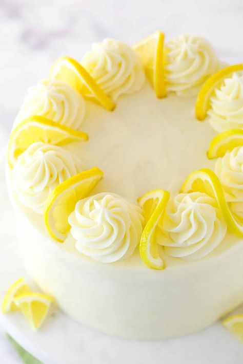 This lemon layer cake is bursting with real lemon flavor. Fresh lemon juice is baked into three layers of fluffy vanilla cake that are filled and frosted with vibrant lemon cream cheese frosting. Best Lemon Cake Recipe, Lemon Birthday Cakes, Homemade Lemon Cake, Lemon Layer Cake, Lemon Curd Cake, Lemon Layer Cakes, Lemon Cream Cheese Frosting, Lemon Cream Cheese, Lemon Curd Filling