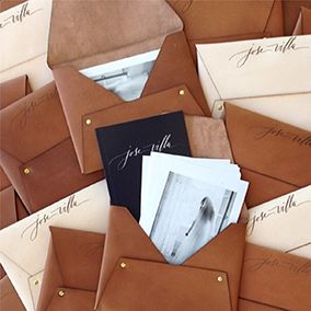 Jose Villa Leather Pouches by Pitbulls and Posies with Anne Robin Calligraphy. Photo by Jose Villa. Calligraphy Branding, Calligraphy Wedding Invitations, Leather Pouches, Jose Villa, Gold Envelopes, Custom Journals, Leather Wedding, Gorgeous Leather, Envelope Design