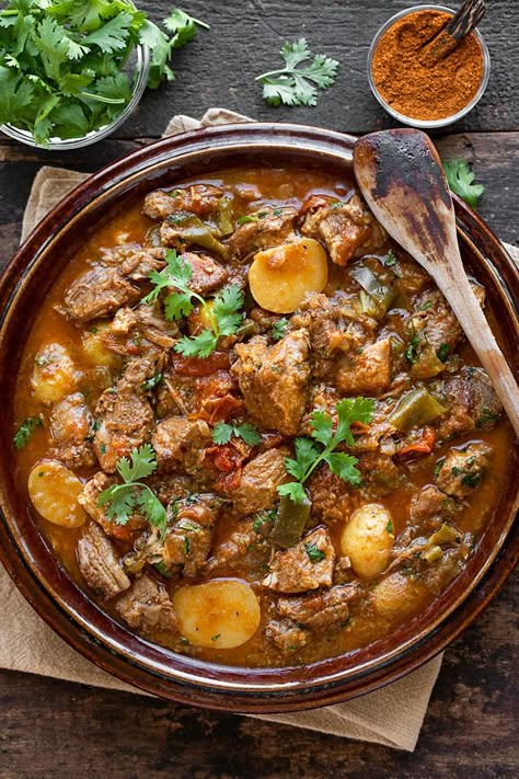 This braised pork shoulder is rich and earthy, prepared with peppers, tomatoes, onions, potatoes and a splash of beer! | thecozyapron.com #braisedporkshoulder #porkshoulder #braisedporkshoulderrecipes #braisedporkshoulderdutchovens Por Shoulder Recipes, Pork Shoulder Cubes Recipes, Cubed Pork Shoulder Recipes, What To Make With Pork Shoulder, Boneless Pork Shoulder Recipes, Pork Shoulder Roast Recipes, Pork Shoulder Stew, Pork Shoulder Steak Recipes, Pork Shoulder Steak