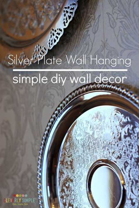 Grab a couple of silver plates for very cheap and make this seriously easy simple diy wall decor! It will dress up any wall. Silver Plates On Wall, Antique Wall Decor Living Room, Silver Platters On Wall, Silver Platter Decor Ideas, Silver Plate Decor, Plate Wall Hanging, Silver Plates, Haeger Pottery, Simple Decorating